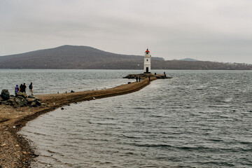 Nature, sights, architecture and life of the city of Vladivostok. Lighthouse in the bay