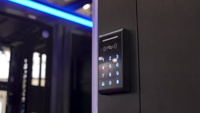 Woman push down electronic control machine with finger scan to access the door of or data center. The concept of data security or data access control.