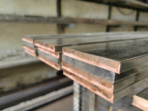  fresh cut copper bars on the table.