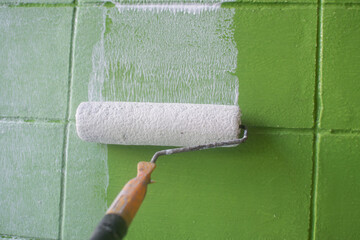 white color painting wall with roller