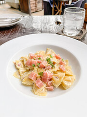 carbonara farfelle pasta with ham sausage
