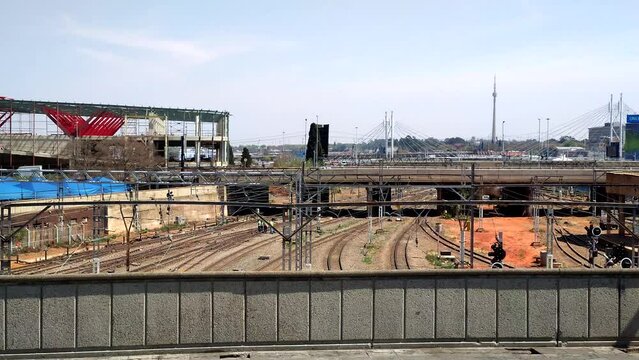 A static shot overlooking the empty railway tracks from the Rissik Street bridge in downtown Johannesburg, South Africa