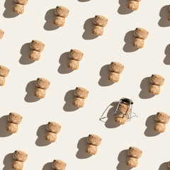 Pattern with champagne cork on beige background with hard light and shadow at sunlight. Trend...