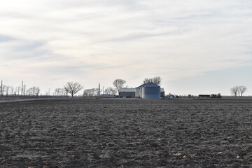 Farm Field with Grain Bins and Barns