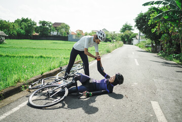 female cyclist having an accident on the road