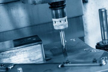 The CNC milling machine rough cutting the injection mold parts by indexable  endmill tools.