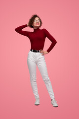 Trendy woman standing in studio