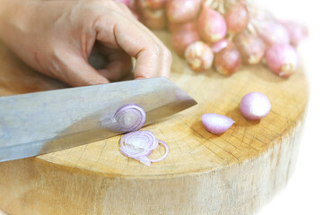 Obraz na płótnie Canvas Sliced onions on the wooden cutting board.