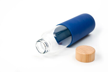 Stylish glass water bottle with wooden lid. For fitness and travel.