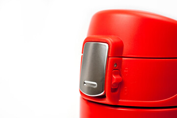 Thermos cup with red-orange vacuum lid for long-term storage of hot and cold drinks. For fitness and travel.