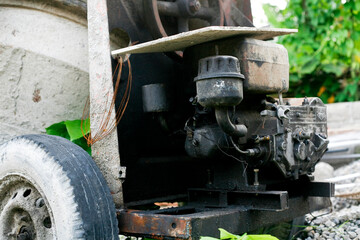 Close up of molen, a concrete or cement mixer machine that has a residue of dry cast dough.