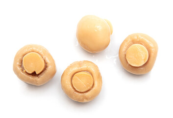 Pickled champignons isolated on a white background.