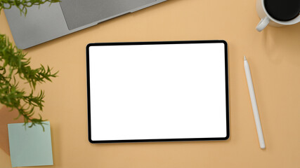 Portable tablet touchpad mockup on beige background. top view