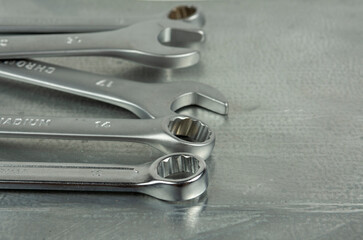metal keys isolated on metallic gray background. copy space