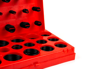Hydraulic and pneumatic O-rings in black in different sizes. o-ring kits red box with many sizes