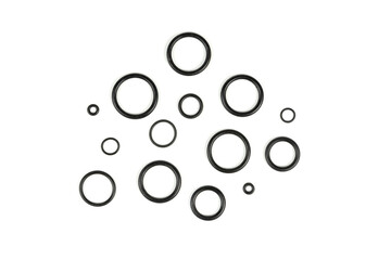 Hydraulic and pneumatic o-rings in black in different sizes on a white background. Various seals for plumbing. Sealing rings for hydraulic connections.