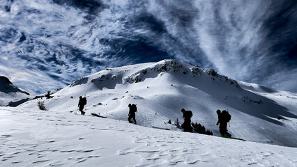 winter hiking activity in peak mountains