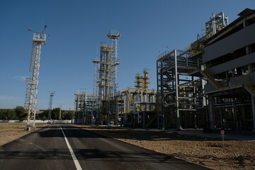 Shymkent / Kazakhstan - 09.26.2018 : Tanks, pipes and metal structures at the Petro Kazakhstan oil processing plant.