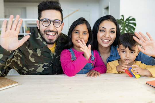 family with children, military father, with laptop video call