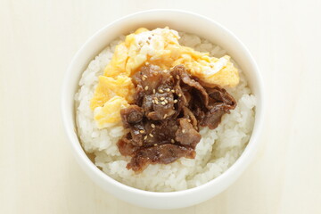 Korean style BBQ beef and scrambled egg on rice for stamina breakfast 