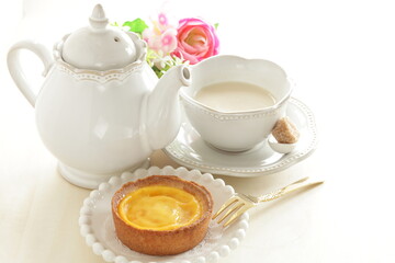 Asian sweet dessert, egg tart on wooden plate with copy space