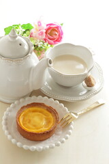 Asian sweet dessert, egg tart on wooden plate with copy space