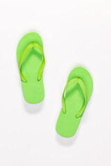 Closeup top view studio isolated shot pair of fashionable beautiful bright green casual comfortable...