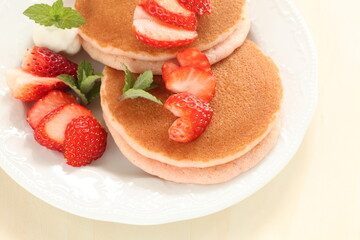 Homemade strawberries and pancake in pink color for cafe food 