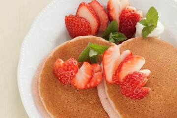 Homemade strawberries and pancake in pink color for cafe food 