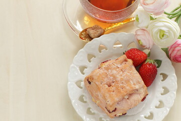 Homemade strawberry scone in pink color for breakfast image