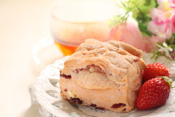 Strawberry scone with berries on side for breakfast image