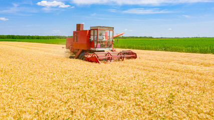 Fototapeta na wymiar Above view on obsolete combine, harvester machine, harvest ripe cereal