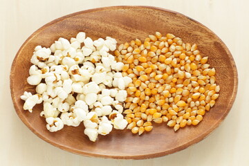 dried corn on wooden plate for cooking popcorn ingredient
