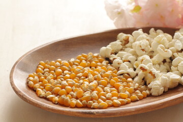 dried corn on wooden plate for cooking popcorn ingredient
