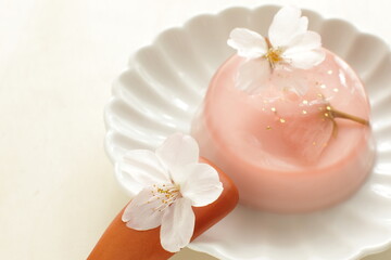 Fototapeta na wymiar Japanese seasonal dessert, cherry blossom jelly with gold dust