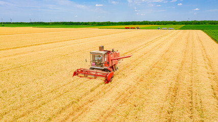 Obraz premium Above view on obsolete combine, harvester machine, harvest ripe cereal