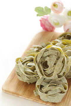 Italian food ingredient, dried spinach fettuccine for cooking image 