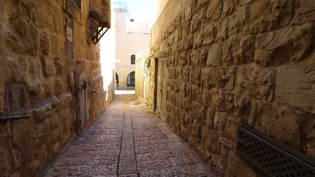 An ancient stone-paved alley in the Jewish Quarter of the Old City of Jerusalem, in the morning