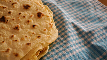 Hand made lavash bread and Turkish breakfast on wooden table
