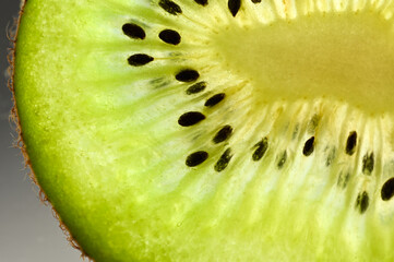 macro photography of ripe fresh kiwi slice. close-up texture kiwi