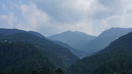 The beautiful mountains landscapes with the green forest and little village as background in the countryside of the China