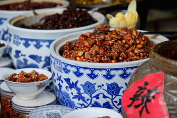 Anchang / China - 05.15.2019 : Vendors sell street food in the Chinese suburban old village of Anchang