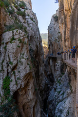 tourists enjoy hiking the Camino del Rey on a bautiful winter day