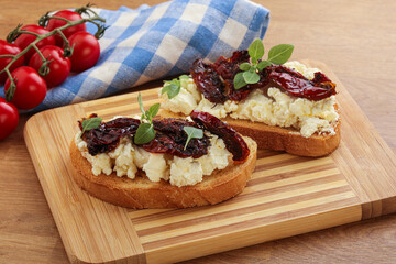 Bruschetta with soft cheese and tomato