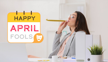Young woman with party whistle in office. April fools day celebration
