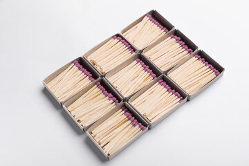 Boxes with whole matches on light background
