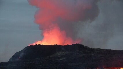Iceland. Volcanic eruption. Flowing lava and craters.