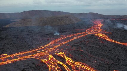 Iceland. Volcanic eruption. Flowing lava and craters.