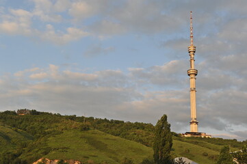 Almaty, Kazakhstan - 05.30.2013 : Kok Tobe TV tower on a hill, in the evening before sunset.