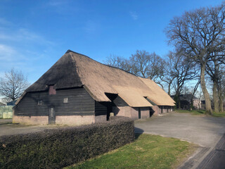 Fototapeta na wymiar Historic saxion farmhouse in Uffelte Drente Netherlands. With new reed roof